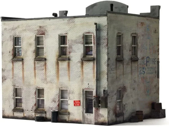 HO scale Records and Recruitment Facility model by Woodland Scenics featuring detailed building with signage and surrounding landscape.